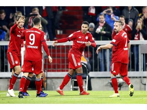 Bayern's Serge Gnabry, center, celebrates with team mates after scoring this side's opening goal during the German Bundesliga soccer match between FC Bayern Munich and SC Freiburg in Munich, Germany, Saturday, Nov. 3, 2018.