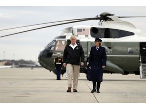 President Donald Trump walks from Marine One helicopter to board Air Force One for a trip to visit areas impacted by the California wildfires, Saturday, Nov. 17, 2018, at Andrews Air Force Base, Md.