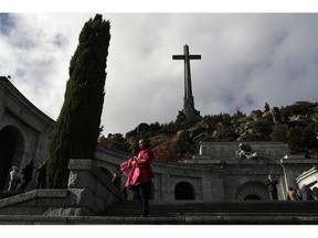 People visit The Valley of the Fallen monument near El Escorial, outside Madrid, Tuesday, Nov. 20, 2018, where ﻿﻿the basilica houses the tomb of former Spanish dictator Francisco Franco. Tuesday marks the 43rd anniversary of the death of Dictator Gen. Francisco Franco.