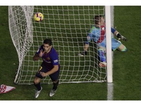 FC Barcelona's Luis Suarez celebrates after scoring during the Spanish La Liga soccer match between Rayo Vallecano and FC Barcelona at the Vallecas stadium in Madrid, Spain, Saturday, Nov. 3, 2018.