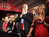 People watch returns being broadcast at an election night event for Florida Governor Rick Scott on Nov. 6, 2018 in Naples, Florida.