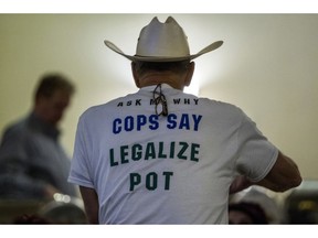 Retired Bath Township Police Det. Howard "Cowboy" Wooldrige waits for election results to come in for Proposal 18-1 during the Coalition to Regulate Marijuana Like Alcohol public watch party at The Radisson in Lansing, Mich., on Tuesday, Nov. 6, 2018.