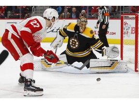 Boston Bruins goaltender Tuukka Rask (40) stops a Detroit Red Wings center Michael Rasmussen (27) shot in the second period of an NHL hockey game Wednesday, Nov. 21, 2018, in Detroit.