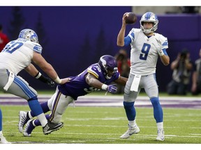 Detroit Lions quarterback Matthew Stafford (9) is sacked by Minnesota Vikings defensive tackle Tom Johnson during the second half of an NFL football game, Sunday, Nov. 4, 2018, in Minneapolis.