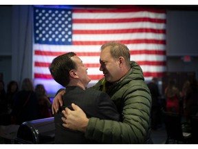 Republican gubernatorial candidate Jeff Johnson was engulfed in a hug by Lance Juffer of Hutchinson as he worked his way around the ballroom with his running mate, Donna Bergstrom, at The Republican Party of Minnesota election night gathering at the Doubletree by Hilton Hotel in Bloomington, Minn., Tuesday, Nov. 6, 2018.