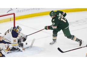 Buffalo Sabres goaltender Linus Ullmark, of Sweden, (35) stops a shot by Minnesota Wild left wing Marcus Foligno (17) during the first period of an NHL hockey Saturday, Nov. 17, 2018, in St. Paul, Minn.