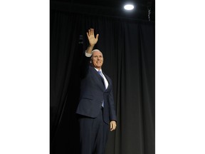 Vice President Mike Pence waves to the crowd during a rally hosted by the American Conservative Union Friday, Nov. 2, 2018, in Kansas City, Mo.