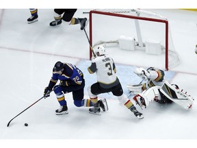 St. Louis Blues' Oskar Sundqvist (70), of Sweden, spins around to score past Vegas Golden Knights goaltender Marc-Andre Fleury, right, and Brayden McNabb (3) during the first period of an NHL hockey game Thursday, Nov. 1, 2018, in St. Louis.