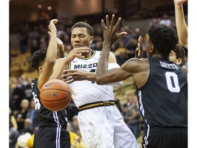 Missouri's Javon Pickett, left, has the ball knocked away by Central Arkansas' SK Shittu, right, during the first half of an NCAA college basketball game Tuesday, Nov. 6, 2018, in Columbia, Mo.
