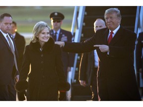 President Donald Trump points as the walks with Sen. Cindy Hyde-Smith, R-Miss., at Tupelo Regional Airport, Monday, Nov. 26, 2018, in Tupelo, Miss.
