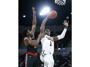 Mississippi State forward Reggie Perry (1) goes up for a shot as Austin Peay guard Terry Taylor (21) tries to defend during the first half of an NCAA college basketball game, Friday, Nov. 9, 2018, in Starkville, Miss.