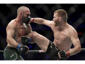 Matt Frevola, right, lands a punch on Lando Vannata during the third round of a lightweight mixed martial arts bout at UFC 230, Saturday, Nov. 3, 2018, at Madison Square Garden in New York.