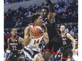 Mississippi's KJ Buffen (14) is defended by Nicholls' Ryghe Lyons (35) in an NCAA college basketball game in Oxford, Miss., Tuesday, Nov. 20, 2018.