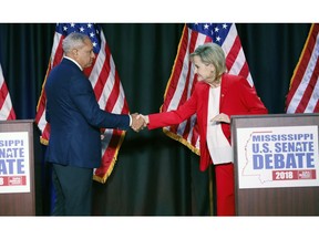 Appointed U.S. Sen. Cindy Hyde-Smith, R-Miss., and Democrat Mike Espy greet each other before their televised Mississippi U.S. Senate debate in Jackson, Miss., Tuesday, Nov. 20, 2018.