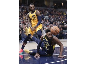 Indiana Pacers guard Tyreke Evans (12) loses the ball after falling in front of Utah Jazz forward Jae Crowder (99) during the first half of an NBA basketball game in Indianapolis, Monday, Nov. 19, 2018.