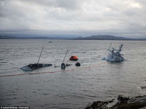Pictures released by the Forsvaret, Norway's armed forces, on Tuesday morning showed the KNM Helge Ingstad almost totally submerged having run aground last week. The frigate collided with a UK-bound oil tanker and rolled onto its side on Friday despite the crew's insistence the situation was 'under control'.