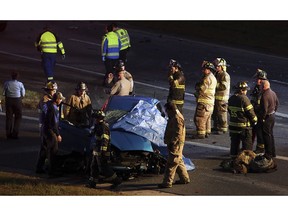Bessemer City firefighters, GEMS and North Carolina Highway Patrol officers work on the scene of a fatal wreck involving a wrong-way driver who was traveling north in the southbound lanes of I-85 at exit 10b near Kings Mountain, N.C., Thursday, Nov. 15, 2018.