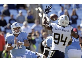North Carolina quarterback Nathan Elliott (11) has a pass blocked by Georgia Tech's Anree Saint-Amour (94) during the first half of an NCAA college football game in Chapel Hill, N.C., Saturday, Nov. 3, 2018.