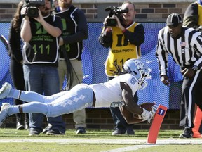 North Carolina's Michael Carter (8) scores a touchdown against Duke during the first half of an NCAA college football game in Durham, N.C., Saturday, Nov. 10, 2018.