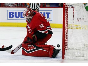 Carolina Hurricanes goaltender Scott Darling (33) has the puck slip past for a goal by the Columbus Blue Jackets during the first period of an NHL hockey game, Saturday, Nov. 17, 2018, in Raleigh, N.C.