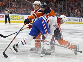 The Edmonton Oilers' Leon Draisaitl (29) battles the Montreal Canadiens' Jeff Petry (26) and Andrew Shaw (65) during first period NHL action at Rogers Place, in Edmonton Tuesday Nov. 13, 2018.