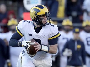 Michigan quarterback Shea Patterson looks to pass against Rutgers during the first half of an NCAA college football game, Saturday, Nov. 10, 2018, in Piscataway, N.J.