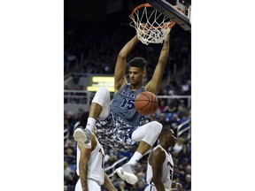 Nevada's Trey Porter dunks against Pacific in the first half of an NCAA college basketball game, Friday, Nov. 9, 2018, in Reno, Nev.