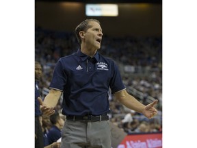 Nevada coach Eric Musselman works the sideline during the first half of the team's NCAA college basketball game against Little Rock in Reno, Nev., Friday, Nov. 16, 2018.