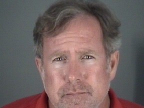 This photo provided by Pasco County Sheriff's Office shows Edward John Abernathy.  Abernathy, a Florida elementary school principal is accused of stealing $900 from a mentally disabled 9-year-old. Abernathy was arrested Thursday, Nov. 8, 2018 and charged with grand theft. A Pasco County Sheriff's Office release says deputies were told the child brought $2,100 of his parents' money to Connerton Elementary School in Land O'Lakes in October. (Pasco County Sheriff's Office via AP)