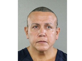FILE - In this undated photo released by the Broward County Sheriff's office, Cesar Sayoc is seen in a booking photo, in Miami. Sayoc, accused of sending pipe bombs to prominent critics of President Donald Trump has been indicted on charges carrying a potential penalty of life in prison. The 30-count indictment in Manhattan federal court was filed on Friday, Nov. 9, 2018 against Sayoc. (Broward County Sheriff's Office via AP)