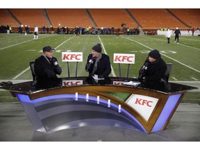 FILE - In this Thursday, Dec. 8, 2016 file photo, announcers from left: Mike Tirico, Tony Dungy and Rodney Harrison work on the set inside Arrowhead Stadium before an NFL football game between the Kansas City Chiefs and the Oakland Raiders, in Kansas City, Mo. When fans tune into NBC's Thanksgiving night broadcast of the Falcons-Saints game, they might do a double take. Rather than seeing Mike Tirico, Tony Dungy and Rodney Harrison in the studio for the pregame and halftime programs, those three gentlemen will be calling the game.