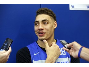 FILE - In this Oct. 11, 2018, file photo, Kentucky's Reid Travis reacts to a reporters question during the school's NCAA college basketball media day, in Lexington, Ky. Travis came to Kentucky as a graduate transfer after earning first-team all-Pac-12 honors with Stanford each of the last two seasons.