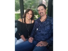 In this Nov. 2018 photo, Jed Copham, and wife Kristi Copham pose for a photo in Fort Myers, Fla.. Jed Copham, the owner of Brainerd International Raceway in Minnesota has died in a swimming accident off the coast of Florida. Jed Copham was 46. The raceway says Copham had been swimming from his parents' boat near Fort Myers when he went missing. The Lee County Sheriff's Office says authorities recovered his body the next day. Copham had owned the raceway near Brainerd in central Minnesota since 2006.