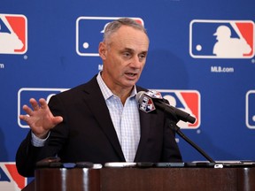 FILE - In this Nov. 16, 2017, file photo, baseball Commissioner Rob Manfred speaks during a news conference at the annual MLB owners meetings in Orlando, Fla. A person familiar with the agenda tells The Associated Press that owners plan to vote on a new term for Manfred, a new television contract with Fox and an agreement for in-game cut-ins with the subscription video streaming service DAZN when they meet next week in Atlanta.