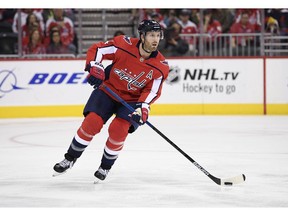 FILE - In this Oct. 19, 2018, file photo, Washington Capitals defenseman Brooks Orpik skates with the puck during the third period of an NHL hockey game against the Florida Panthers, in Washington. Orpik underwent arthroscopic surgery on his right knee and is expected to miss four to six weeks. The team announced the surgery and time frame Tuesday, Nov. 20, 2018.