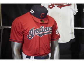 The Cleveland Indians display their 2019 uniforms, including a new home alternate red jersey, Monday morning, Nov. 19, 2018, at the Progressive Field Team Shop in Cleveland, Ohio.