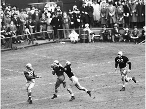 FILE - In this Nov. 9, 1946, file photo, Notre Dame's Emil Sitko (14) grabs a pass intended for Army's Bill West, center right, during the fourth quarter of a college football game at Yankee Stadium in New York. At left, Notre Dame quarterback John Lujack (32) holds out his hands for a possible lateral. The game ended in a scoreless tie. The Fighting Irish were regular visitors to the New York area during the first half of the 20th Century, when their wanderlust turned Notre Dame football into America's team.