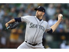 FILE - In this Saturday, Sept. 1, 201 file photo ,Seattle Mariners pitcher James Paxton works against the Oakland Athletics during the first inning of a baseball game in Oakland, Calif. A person familiar with the negotiations tells The Associated Press the New York Yankees have agreed to acquire left-hander James Paxton from the Seattle Mariners for left-hander Justus Sheffield and two other prospects, Monday, Nov. 19, 2018.