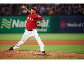 FILE - In this April 10, 2018, file photo, Texas Rangers relief pitcher Jesse Chavez pitches during the fourth inning of a baseball game against the Los Angeles Angels, in Arlington, Texas. Right-hander Jesse Chavez finalized an $8 million, two-year contract with the Texas Rangers on Friday, Nov. 30, 2018, returning to the team that traded him to the Chicago Cubs last July.