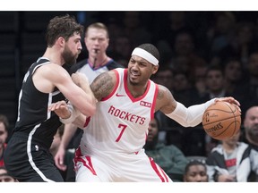 FILE - In this Friday, Nov. 2, 2018 file photo, Brooklyn Nets forward Joe Harris guards Houston Rockets forward Carmelo Anthony (7) during the second half of an NBA basketball game in New York. Carmelo Anthony is done in Houston. Rockets general manager Daryl Morey released a statement Thursday, Nov. 15, 2018 saying the team is "parting ways" with Anthony and "working toward a resolution."