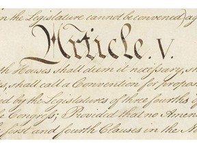 This photo made available by the U.S. National Archives shows a portion of the United States Constitution with the title of Article V. For the past two centuries, constitutional amendments have originated in Congress, where they need the support of two-thirds of both houses, and then the approval of at least three-quarters of the states. But under a never-used second prong of Article V, amendments can originate in the states. (National Archives via AP)