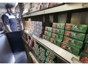 FILE - This May 17, 2018 file photo shows packs of menthol cigarettes and other tobacco products at a store in San Francisco. On Thursday, May 15, 2018, FDA Commissioner Dr. Scott Gottlieb pledged to ban menthol from cigarettes, in what could be a major step to further push down U.S. smoking rates.