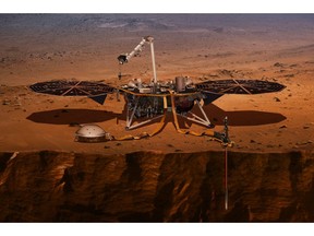 FILE - This illustration made available by NASA in 2018 shows the InSight lander drilling into the surface of Mars. InSight, short for Interior Exploration using Seismic Investigations, Geodesy and Heat Transport, is scheduled to arrive at the planet on Monday, Nov. 26, 2018. (NASA via AP)