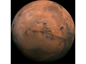 FILE - This image made available by NASA shows the planet Mars. This composite photo was created from over 100 images of Mars taken by Viking Orbiters in the 1970s. In our solar system family, Mars is Earth's next-of-kin, the next-door relative that has captivated humans for millennia. The attraction is sure to grow on Monday, Nov. 26 with the arrival of a NASA lander named InSight.  (NASA via AP, File)