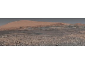 FILE - This image provided by NASA, assembled from a series of January 2018 photos made by the Mars Curiosity rover, shows an uphill view of Mount Sharp, which Curiosity had been climbing. In our solar system family, Mars is Earth's next-of-kin, the next-door relative that has captivated humans for millennia. The attraction is sure to grow on Monday, Nov. 26 with the arrival of a NASA lander named InSight. (NASA/JPL-Caltech/MSSS via AP, File)