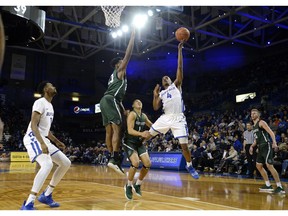 Buffalo guard Davonta Jordan (4) drives to the basket while defended by Dartmouth forward Chris Knight (23) during the first half of an NCAA college basketball game in Buffalo, N.Y., Wednesday, Nov. 21, 2018.