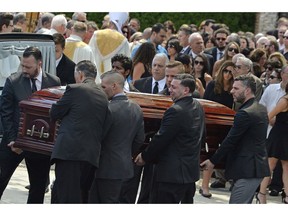 FILE - In this Aug. 6, 2016 file photo, mourners carry the casket of Karina Vetrano from St. Helen's Church following her funeral in the Howard Beach section of the Queens borough of New York. The trial of a man accused of killing Vetrano, a New York City woman who was sexually attacked while jogging near her family's home, has ended in a hung jury. A judge late Tuesday, Nov. 20, 2018, granted a mistrial after the jury said it was split after just a day and a half of deliberations.