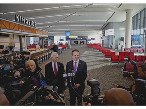 New York's Governor Andrew Cuomo, right, and Rick Cotton, left, executive director of the Port Authority, hold a press briefing inside the new Terminal B in LaGuardia Airport, Thursday Nov. 29, 2018, in New York.