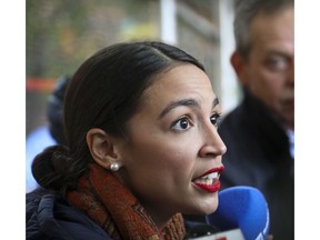 New York Democratic congressional candidate Alexandria Ocasio-Cortez speaks with reporters after voting, Tuesday Nov. 6, 2018, in the Parkchester community of the Bronx, N.Y.