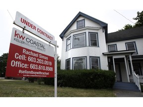 FILE- In this June 20, 2018, file photo, an "Under Contract" sign is displayed in front of home for sale in Raymond, N.H. On Thursday, Nov. 29, the Standard & Poor's/Case-Shiller 20-city home price index for September is released.